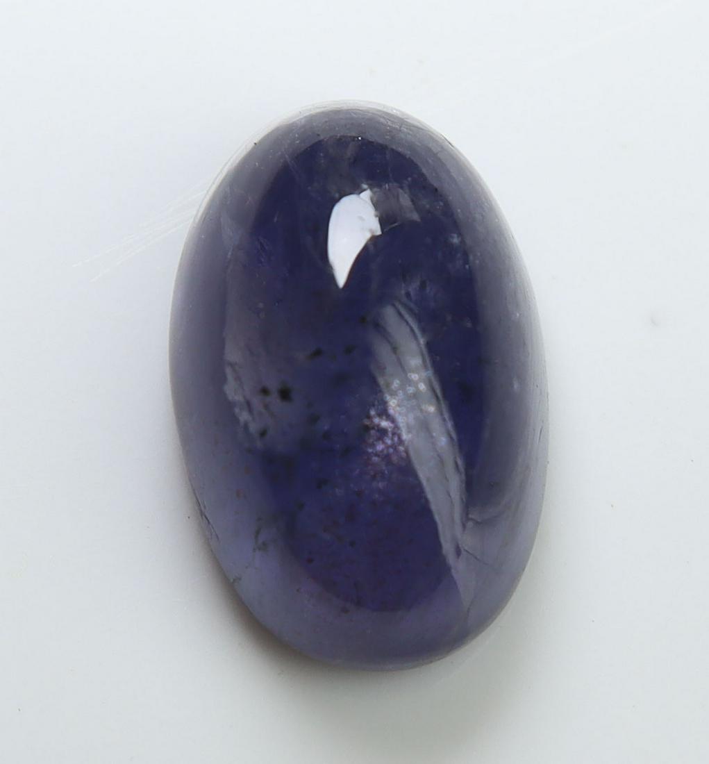 3.73 cts Natural Iolite: No Reserve! Title: 3.73 cts Natural Iolite Additional Information: Gemstone : Natural Iolite Shape and cut : Oval Cabochon Weight : 3.73 carats Measurements : 12x8 mm , Color : Violite Transparency :