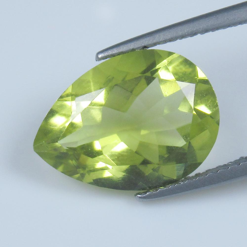 Natural Lemon Quartz - 4.96 Ct: No Reserve! Title: Natural Lemon Quartz - 4.96 Ct Origin: Brazil Weight: 4.96 Size/Dimensions: 14.0 x 10.3 x 6.4 mm Additional Information: Pieces : 1 No's / Shape : Pear Cut / Color : Greenish Yellow