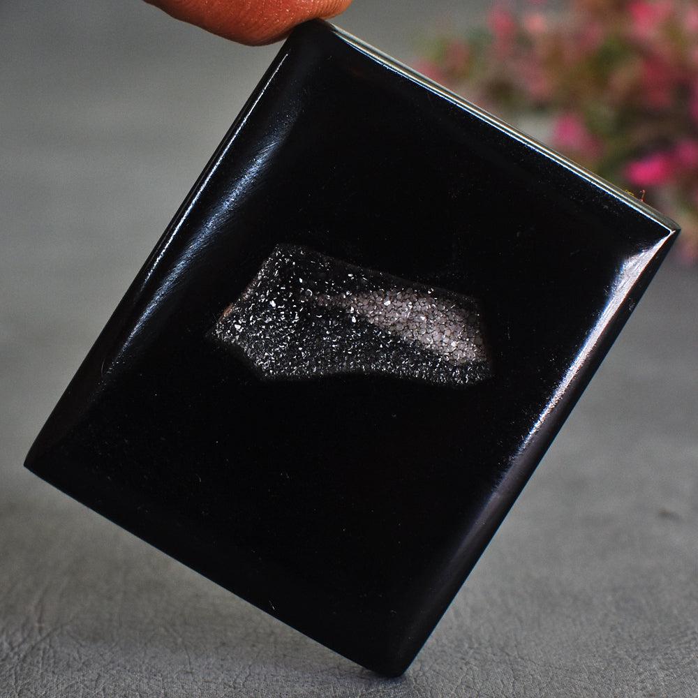 Exclusive 87 Carats Genuine Black Druzy Onyx Gemstone: Product : Genuine Black Druzy Onyx Gemstone Weight : 87.00 Carats Color : As seen in picture Treatment : NoneDimensions : 41 X 34 X 04 MM Clarity : Opaque Code : 1 C4 (AL)Natural Black Druzy Onyx Gems