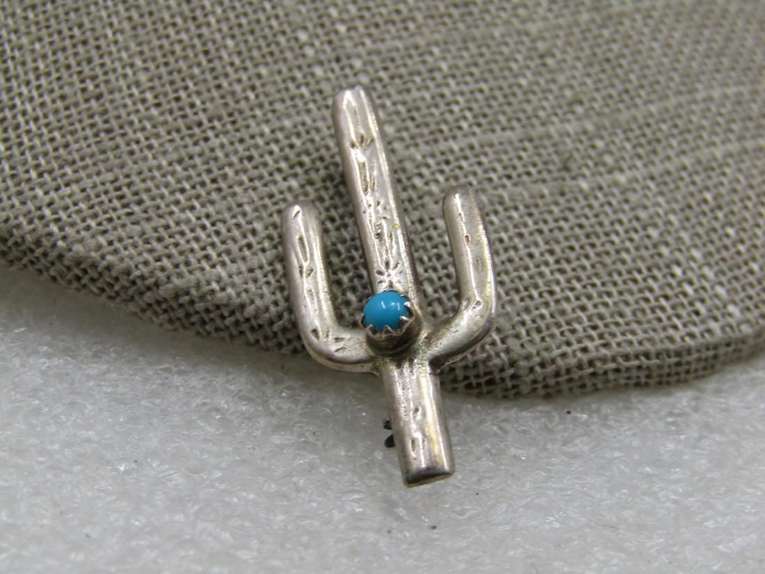 Vintage Sterling Southestern Turquoise Cactus Brooch, Snake Eye, 1.25": Vintage Sterling Southestern Turquoise Cactus Brooch, Snake Eye, 1.25" tall and 5/8" wide. It is not marked or signed . Tested twice and is s terling with a 1.99 gr. weit. The snake eye turquoise ston