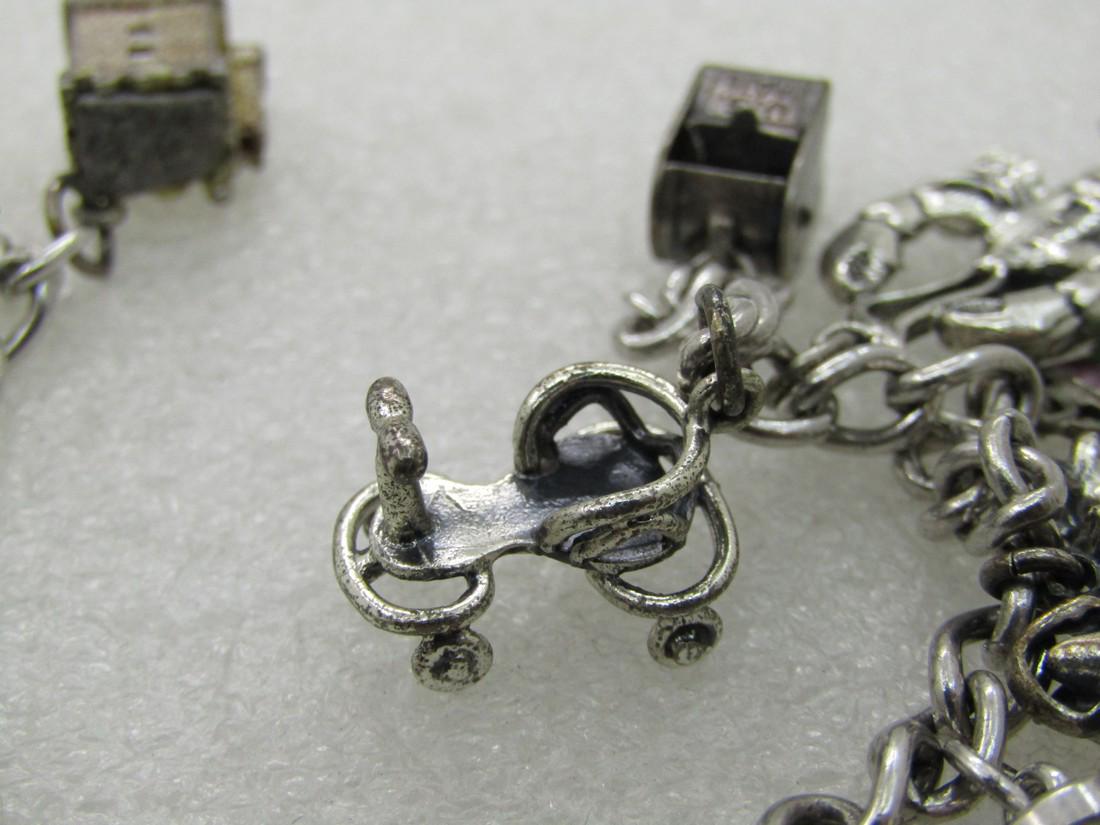 Vintage Sterling Silver Charm Bracelet, 7", 12 Charms, Travel Plus, 1960's: Vintage Sterling Silver Charm Bracelet, 1960's, 12 Charms,Scottish Thistle; lobster, old time scooter, mail box, castle; cow, hour glass; train and operator; NY 1961 World's Fair; cuckoo clock; crab t