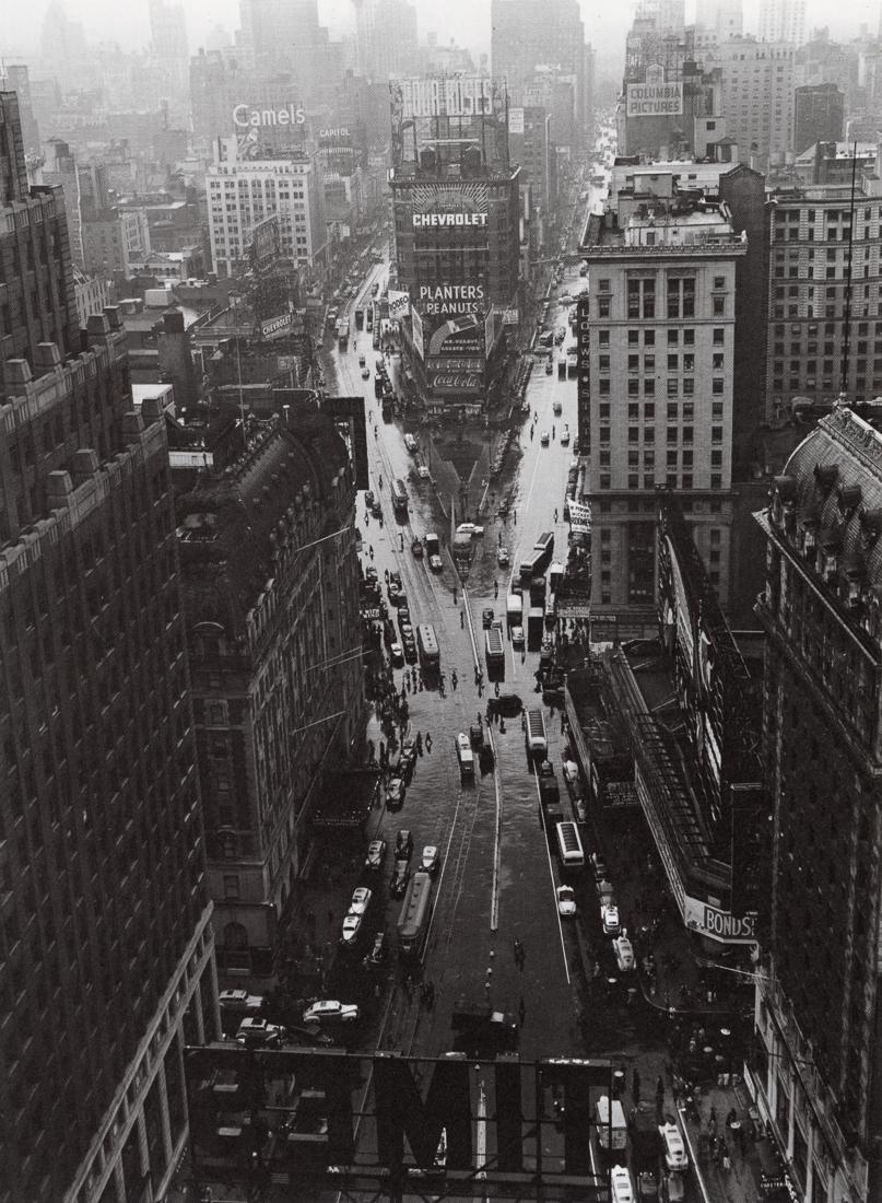 LOU STOUMEN - Times Square in Rain, 1940: Artist: Lou Stoumen Title: Times Square in Rain, 1940 Medium: Photo Litho, 1983, USA Dimensions: 6.7x9.15" Description: Heat Wax Mounted on 11x14" Conservation Board Artist Bio: Louis Clyde Stoumen (1
