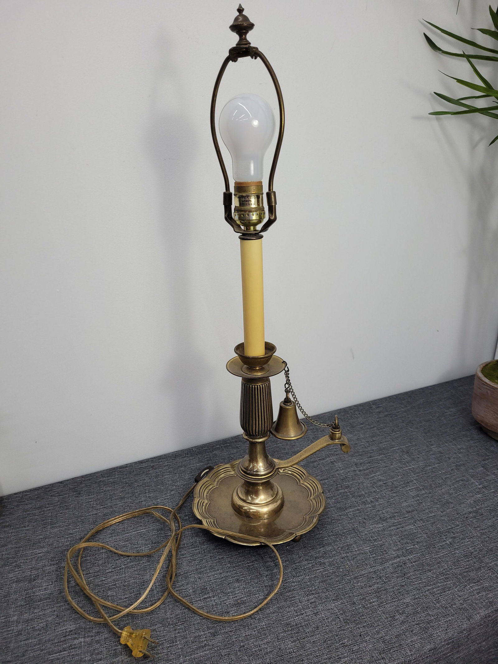 Vintage Frederick Cooper Brass Candlestick Table Lamp Bell Antique Lighting: Vintage from the 1970s Materials: brass, metal, linen Width: 8.5 inches Height: 24 inches Depth: 7 inches Description Vintage Frederick Cooper Table Lamp Brass Candlestick Lamp with Brass Bell In very