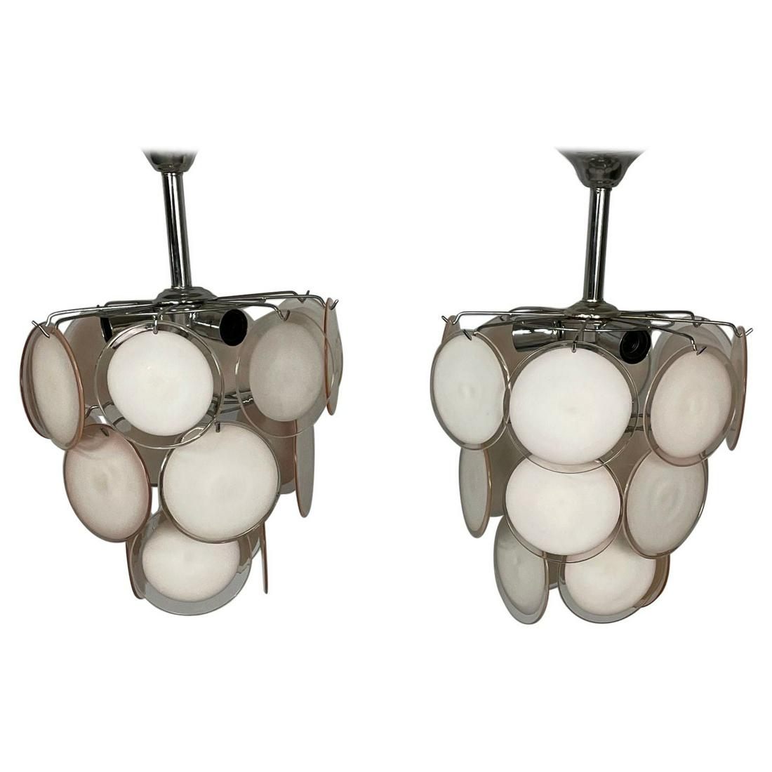 Pair of Mid-Century Modern Style Small Pink Murano Glass Disk Chandeliers: Title: Pair of Mid-Century Modern Style Small Pink Murano Glass Disk Chandeliers Description: Pair of Mid-Century Modern style small pink Murano glass disk chandeliers. A pair of Mid-Century Modern Mu