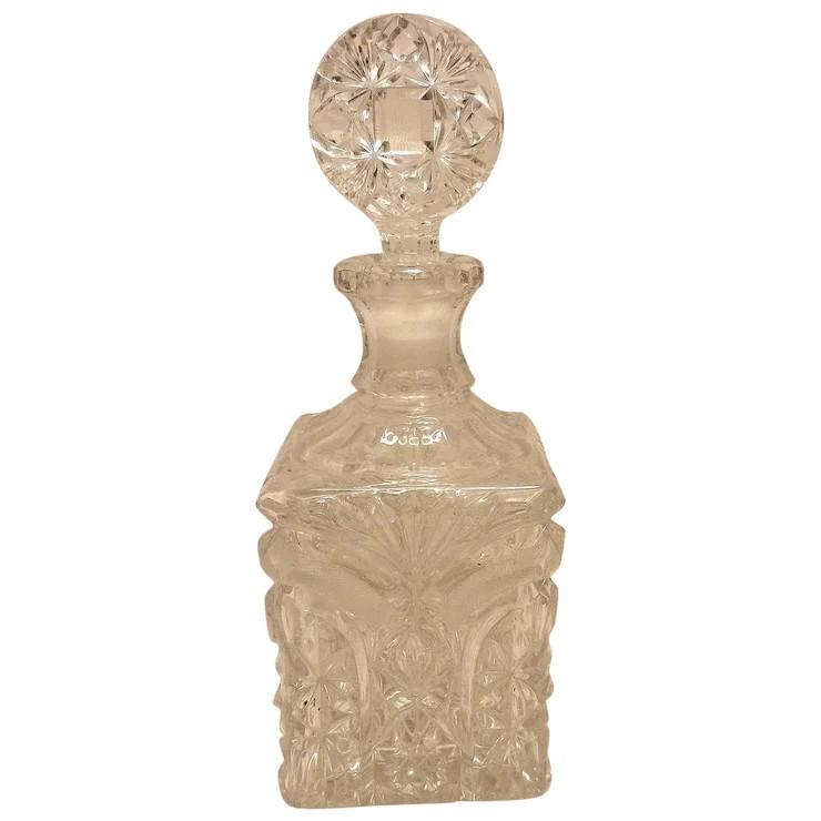 Vintage Square Whiskey Decanter with File Cut Enhanced Design: This Vintage Square Whiskey Decanter with File Cut Enhanced Design is 4” square and most likely made of leaded glass due to its weight. Striking design with an unusual matching glass stopper. No