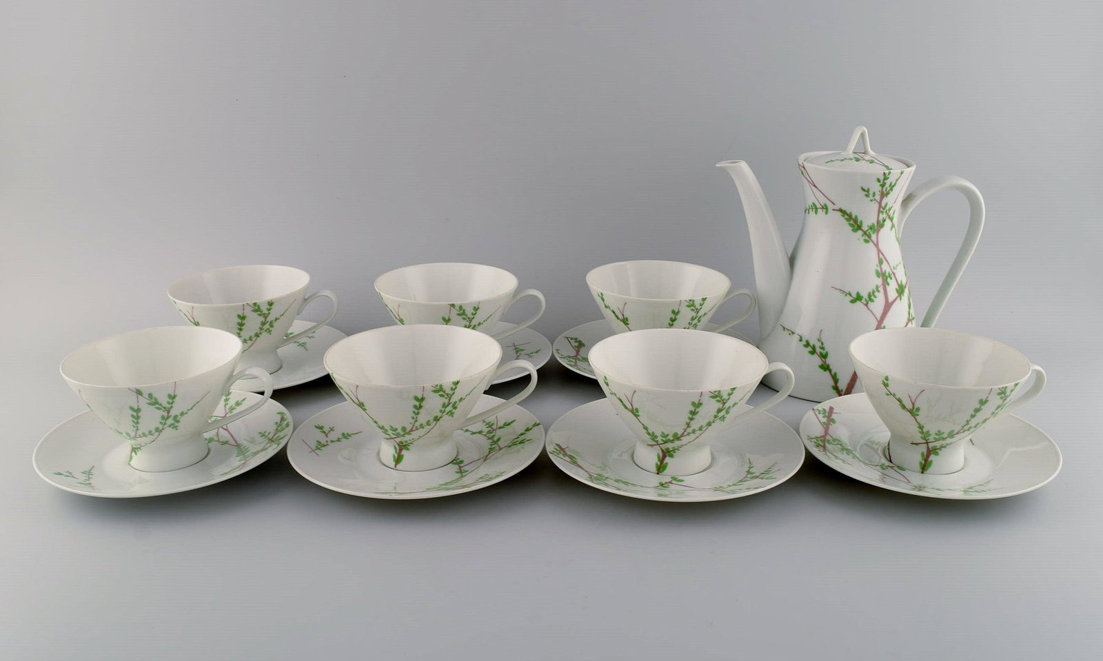 Bjørn Wiinblad for Rosenthal. "Summer" coffee service for seven people. Decorated with branches: Bjørn Wiinblad for Rosenthal. "Summer" coffee service for seven people. Decorated with branches and green leaves. 1970s. Consisting of seven coffee cups with saucers and coffee pot. The cup measu