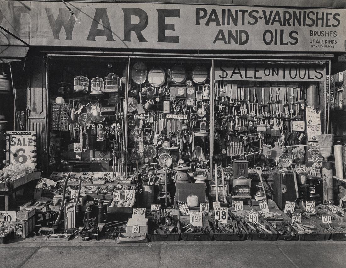BERENICE ABBOTT - Hardware Store, Bowery, 1938: Artist: Berenice Abbott Title: Hardware Store, Bowery, 1938 Medium: Photo Litho, 1973, USA Dimensions: 8.8x6.85" Description: Heat Wax Mounted on 11x14" Conservation Board Artist Bio: Berenice Abbot,