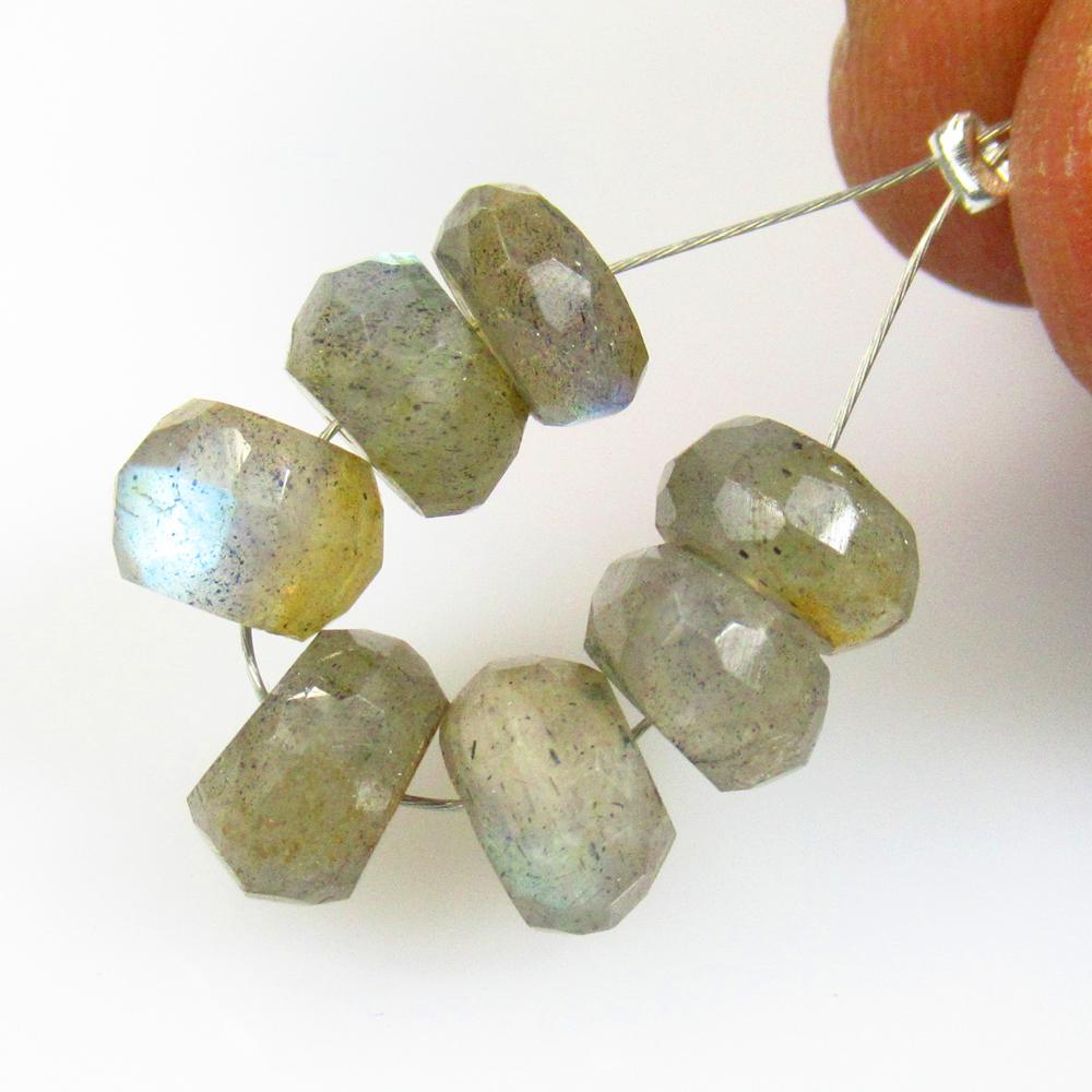12.64 Ct Natural 7 Labradorite Round Beads: No Reserve! Title: 12.64 Ct Natural 7 Labradorite Round Beads Stone Clarity: Transparent Gemstones: Natural Labradorite Beads Carat Weights: 12.64 Size/Dimensions: 6.70 - 7.70 mm / 7 Pc's Additional I