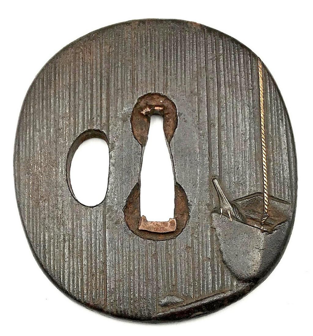 Iron tsuba with a bird, bucket, and well motif. (1 of 4)