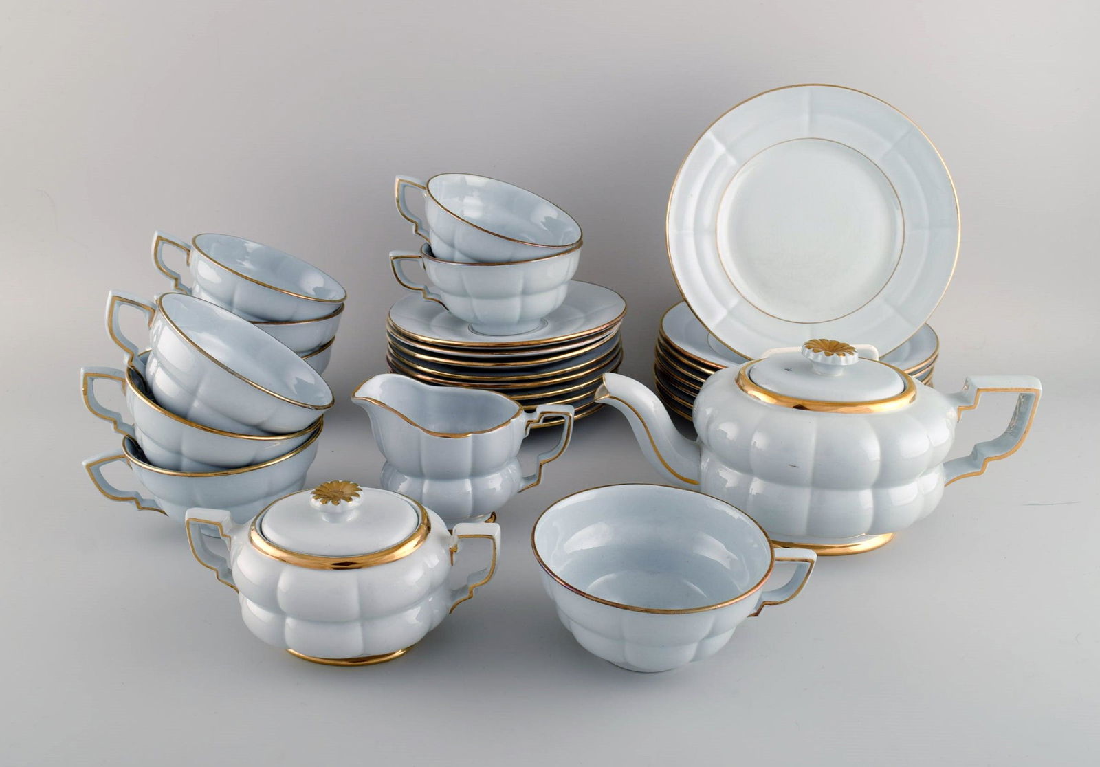 Arthur Percy for Upsala-Ekeby / Gefle. Complete art deco Grand tea service in pastel blue porcelain: Arthur Percy for Upsala-Ekeby / Gefle. Complete art deco Grand tea service in pastel blue porcelain with hand-painted gold edge for eight people. 1930s / 40s. Consisting of eight teacups with saucers,