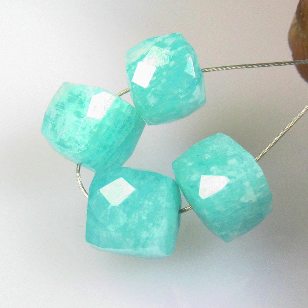 9.35 Ctw Natural 4 Drilled Amazonite Square Beads: No Reserve! Title: 9.35 Ctw Natural 4 Drilled Amazonite Square Beads Stone Clarity: Opaque Gemstones: Natural Amazonite Beads Carat Weights: 9.35 Size/Dimensions: 6.2x5.6 to 6.8x6.5 mm / 4 PC's Additi