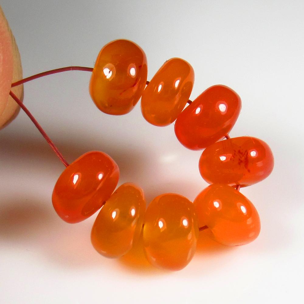 Natural Carnelian Beads - 12.35 Ct: No Reserve! Title: Natural Carnelian Beads - 12.35 Ct Origin: Brazil Weight: 12.35 Size/Dimensions: 6.5 - 6.9 mm Additional Information: Pieces : 8 No's / Shape : Drilled Round Beads / Color : Orange 