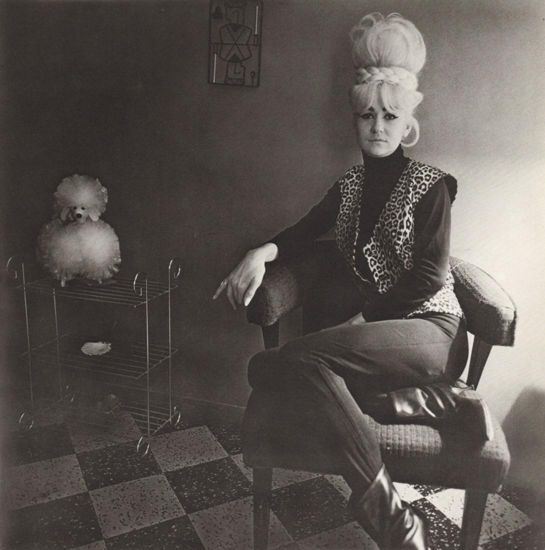 DIANE ARBUS - Lady Bartender at home with souvenir Dog, New Orleans, 1964: Artist: DIANE ARBUS Print Title: Lady Bartender at home with souvenir Dog, New Orleans, 1964 Medium: Authentic Vintage Photoengraving Printed 1970’s in the USA Image size (inches) approx. 8 x 8&