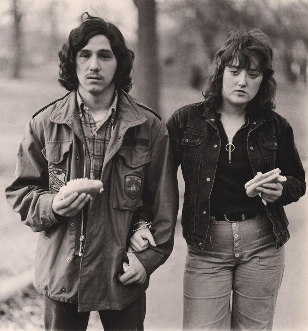 DIANE ARBUS - Young man & his girlfriend with hot dogs in the park, NYC, 1971: Artist: DIANE ARBUS Print Title: Young man & his girlfriend with hot dogs in the park, NYC, 1971 Medium: Authentic Vintage Photoengraving Printed 1970’s in Hong Kong Image size (inches) approx. 
