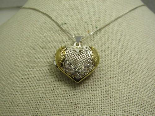 Vintage Two-Tone Heart Locket Necklace, Puffy, 20" Sterling Chain: Vintage Two-Tone Heart Locket Necklace, Puffy, 20". Stering Chain. the heart has a decorated etched front with gold over sterling on the top sides of the front. The locket is marked sterling on the in