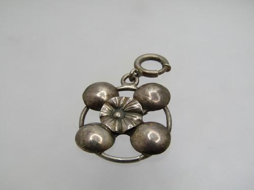 Vintage Sterling, Fob/Charm/Pendant, Floral, 1-3/8": Vintage Sterling, Fob/Charm/Pendant, Floral, 1-3/8" long and 3/4" wide. . This has a 1/3" floral blossom in the center with four round accents sitting on the frame - open areas between the frame and t
