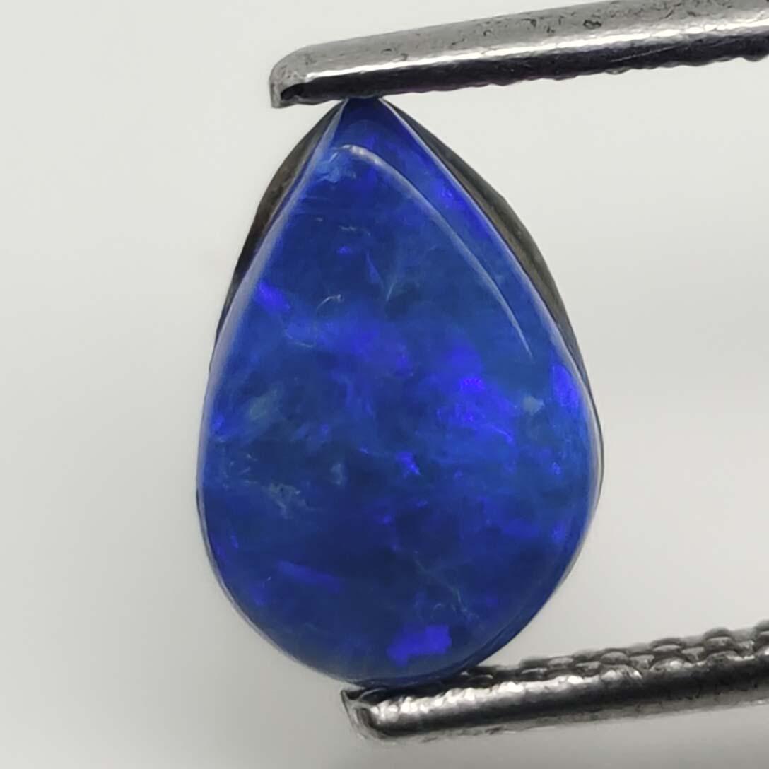 0.95 ct Australian Doublet Opal: Gemstones: Australian Doublet Opal Carat Weights: 0.95 ct Size/Dimensions: 9 X 6 mm Reserve: $5.00 Shipping: Domestic: Flat-rate of $10.00 to anywhere within the contiguous U.S. International: Foreign
