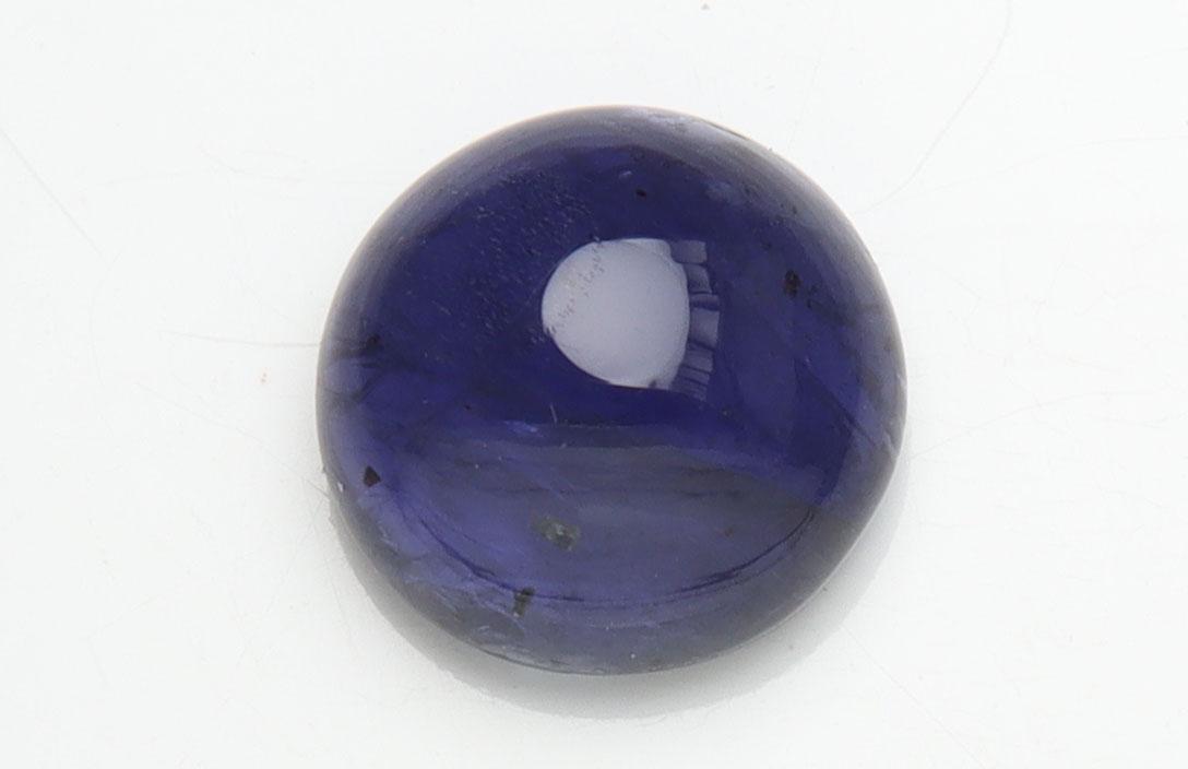 1.37 cts Natural Iolite: No Reserve! Title: 1.37 cts Natural Iolite Additional Information: Gemstone : Natural Iolite Shape and cut : Round Cabochan Weight : 1.37 carats Measurements : 7x7 mm , Color : Violite Transparency :