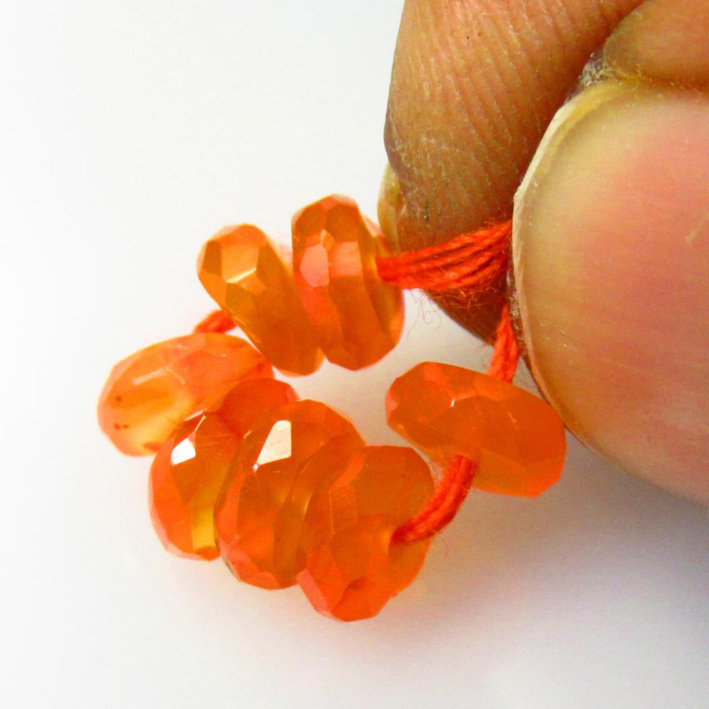 4.90 Ctw Natural 7 Drilled Orange Carnelian Round Beads: No Reserve! Title: 4.90 Ctw Natural 7 Drilled Orange Carnelian Round Beads Stone Clarity: Semi-Transparent Gemstones: Natural Carnelian Beads Carat Weights: 4.9 Size/Dimensions: 5.80 - 6.20 mm / 7 Pc'