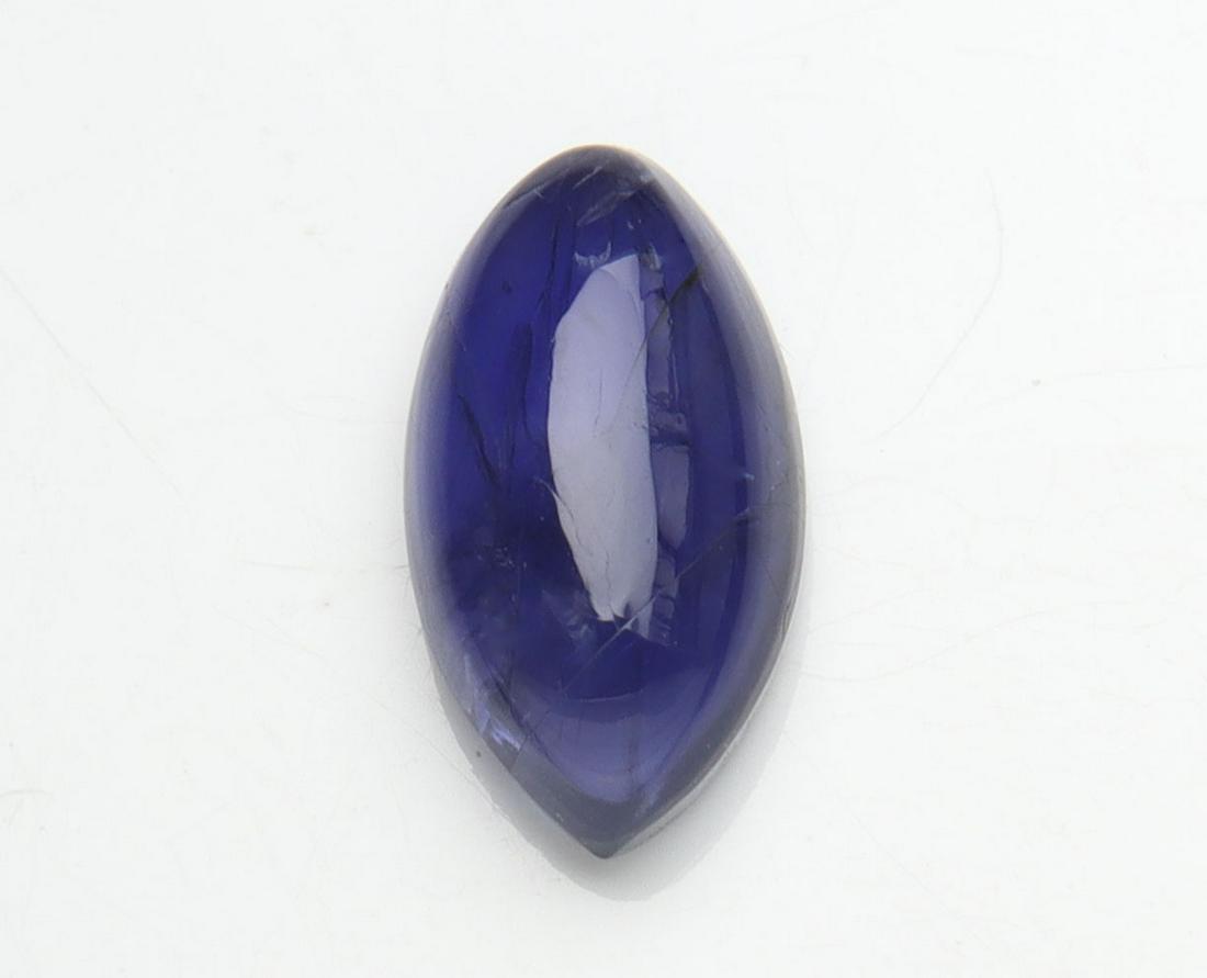 1.37 cts Natural Iolite: No Reserve! Title: 1.37 cts Natural Iolite Additional Information: Gemstone : Natural Iolite Shape and cut : Marquies Cabochan Weight : 1.37 carats Measurements : 10.11x5.45x3.49 mm , Color : Violite