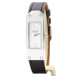 Hermes Kelly II watch KT1.230: Superbe montre HermÃ¨s modÃ¨le Kelly II. - Montre KT1.230 - BoÃ®tier en acier 41.5 x 15.4 mm. - Cadran Ã fond blanc Ã deux Index chiffres arabes pour le 12 et le 6. - BoÃ®tier rectangula