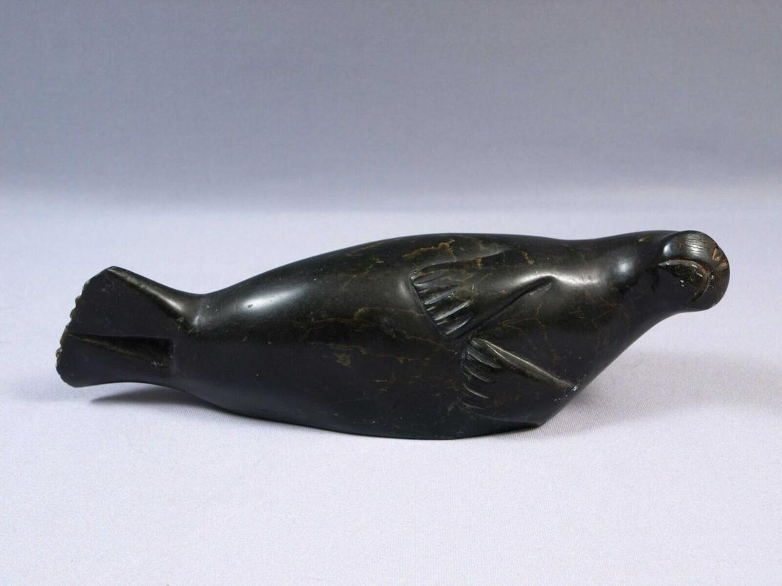 Soapstone Inuit Native Canada Figurine Black Seal Signed Vintage 1982 DH 10": This is a vintage, Native American Canadian Inuit Figurine. It is signed at the bottom with numbers and some letters. It was made in 1982 The figurine is made from black soapstone and is very beautifu