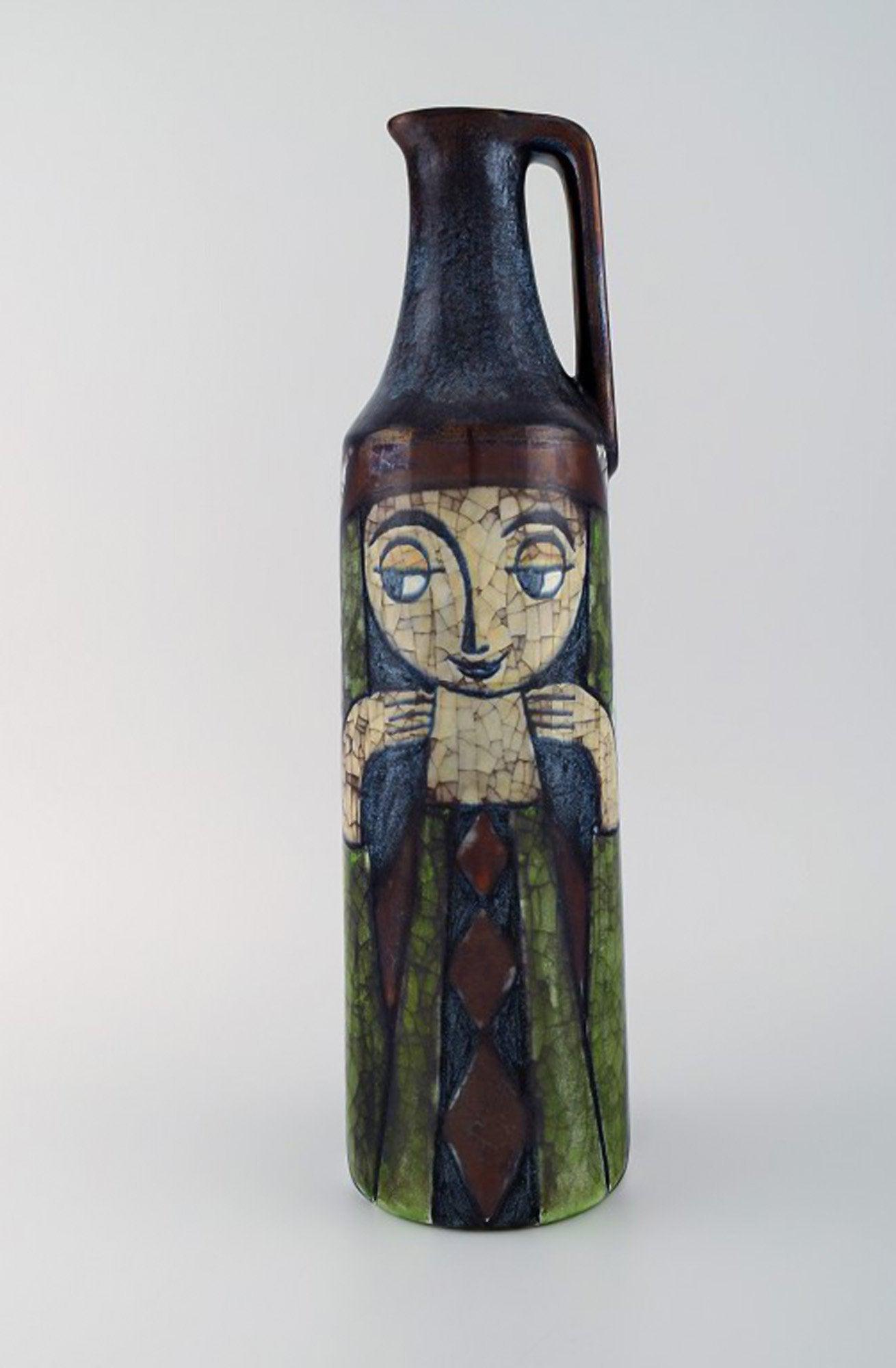 Michael Andersen, Denmark. Large jug in glazed ceramics with young girl. Beautiful crackled glaze.: Michael Andersen, Denmark. Large jug in glazed ceramics with young girl. Beautiful crackled glaze. 1950s. Measures: 37 x 11 cm. In very good condition. Stamped. Reserve: $350.00 Shipping: Domestic: Sh