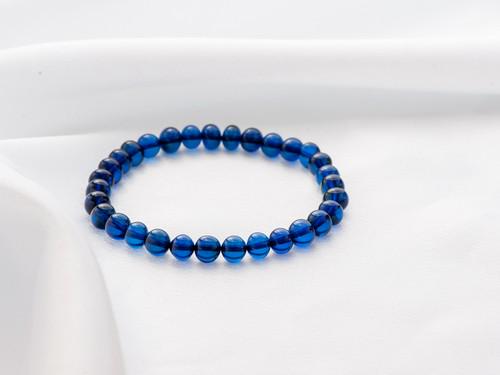 Blue Amber Bracelet made of irregular shape ball beads: Title: Blue Amber Bracelet made of irregular shape ball beads Materials: Blue amber Weight: 6 Additional Information: Amber bracelet made from irregular shape round blue amber beads. Unisex amber brac