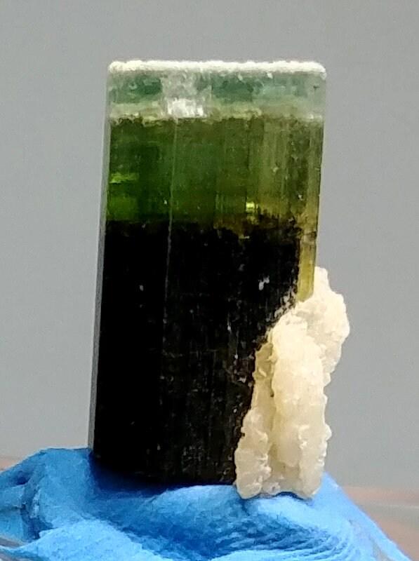 05 Grams Beautiful Green Cap Tourmaline Crystal Specimen From Astak Skardu pakistan: Materials: tourmaline specimen Description Product: Tourmaline Orign: Skardu Pakistan Shape: Specimen Size: 22*12*12 mm Weight: 05 Grams Treatment: Natural Color: Green Cap Reserve: $8.00 Shipping:<