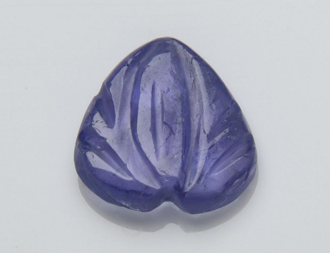 2.01 Cts Natural Tanzanite Carving: No Reserve! Title: 2.01 Cts Natural Tanzanite Carving Additional Information: Gemstone : Natural Tanzanite Carving Origin: Tanzania Weight : 2.01 carats Dimensions : 8.90-8.61x2.87 mm Shape/Cut: Pear 