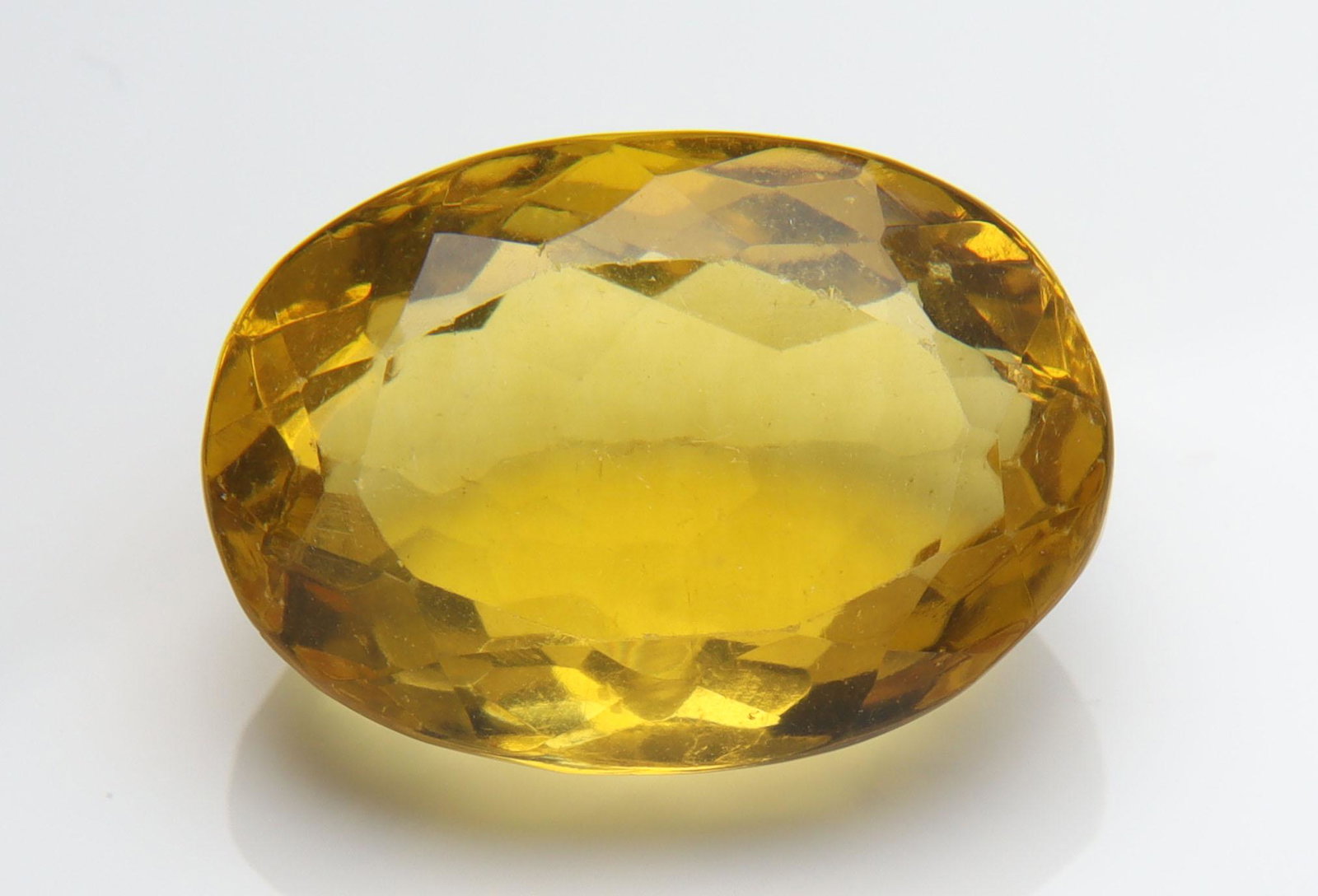 12.40 Cts Natural Yellow Fluorite: No Reserve! Title: 12.40 Cts Natural Yellow Fluorite Additional Information: Gemstone : Natural Yellow Fluorite Origin : Brazil Weight : 12.40 carats Dimensions : 16.41x11.56x8.18 mm Shape : Oval Cut 