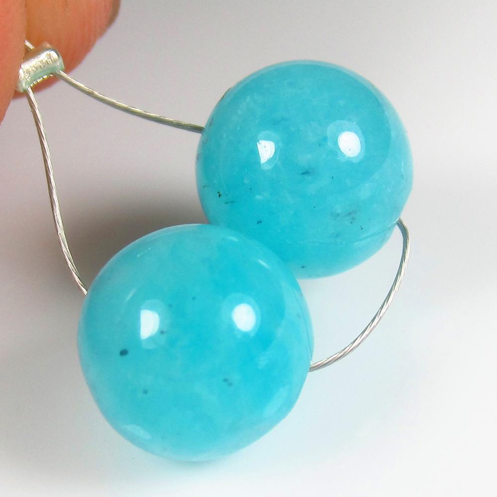 Natural Amazonite Beads - 10.79 Ct: No Reserve! Title: Natural Amazonite Beads - 10.79 Ct Origin: Brazil Weight: 10.79 Size/Dimensions: 10.0 x 10.0 mm Additional Information: Pieces : 2 No's / Shape : Round Drilled / Color : Blue / Clar