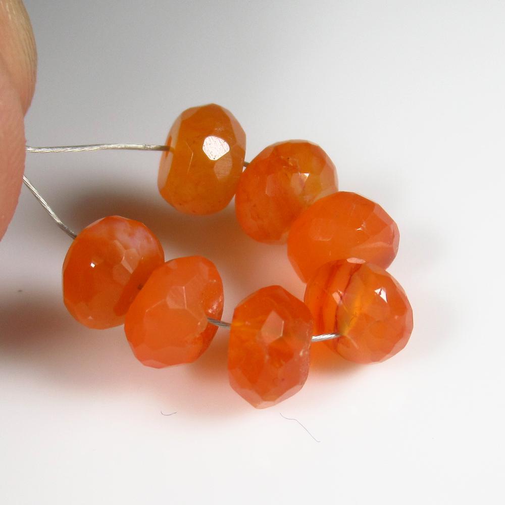 Natural Carnelian Beads - 8.81 Ct: No Reserve! Title: Natural Carnelian Beads - 8.81 Ct Origin: Brazil Weight: 8.81 Size/Dimensions: 6.0 - 6.5 mm Additional Information: Pieces : 7 No's / Shape : Drilled Round Beads / Color : Orange / 