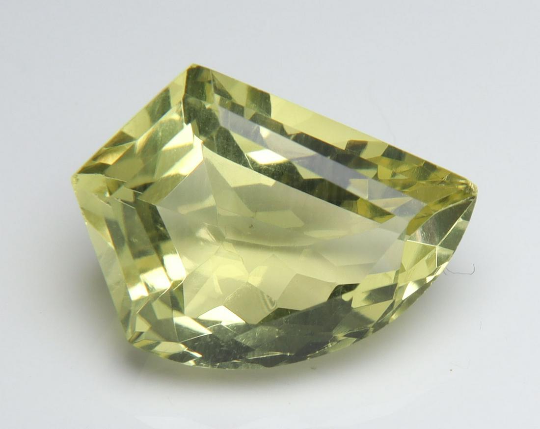 5.24 Cts Natural Lemon Quartz: No Reserve! Title: 5.24 Cts Natural Lemon Quartz Description: Gemstone : Natural Lemon Quartz Shape and cut : Fancy Cut Origin : Africa Weight : 5.24 carats Measurements : 14.51x11.18x6.66 mm Color : 