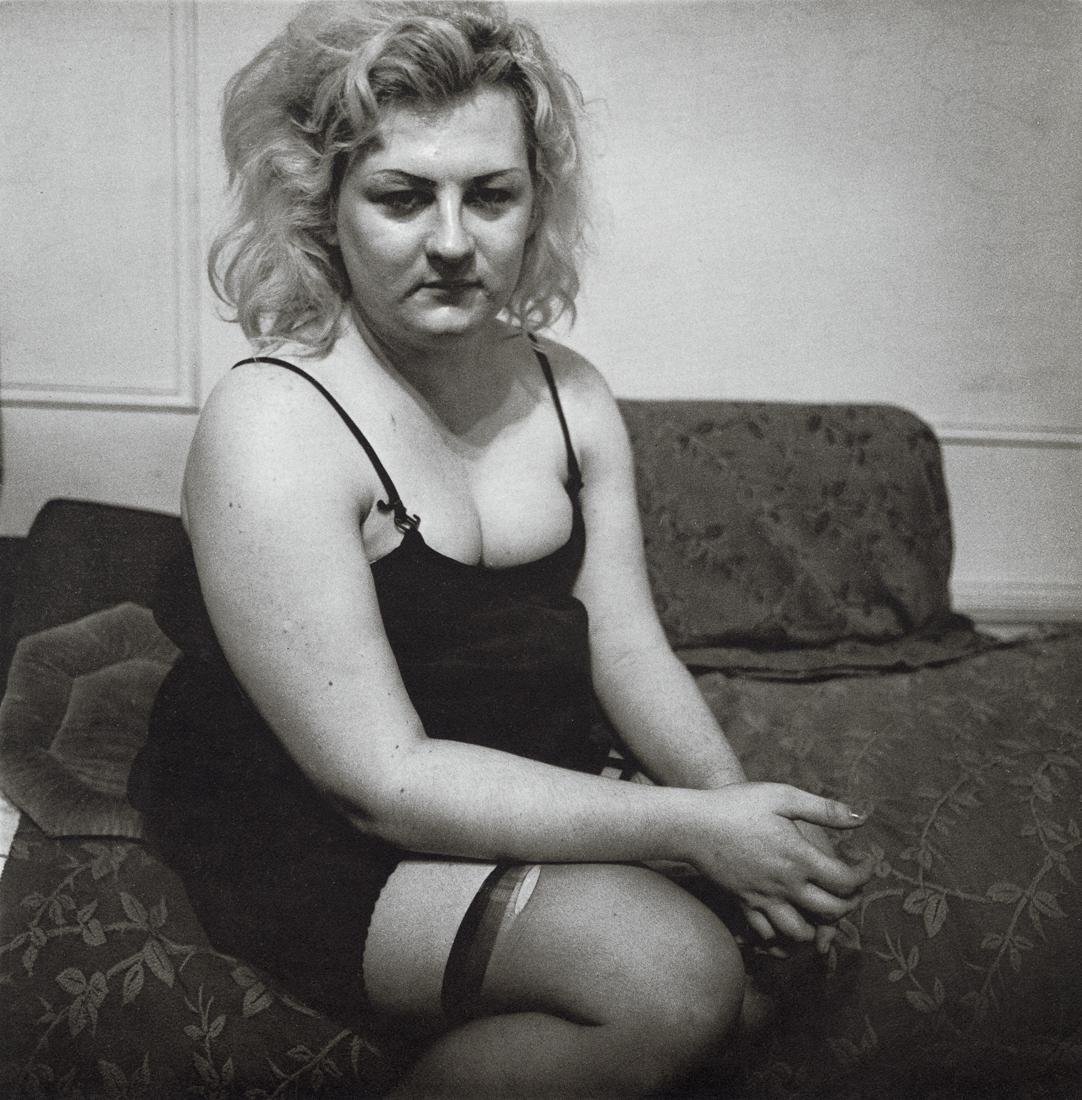 DIANE ARBUS - Transvestite With Torn Stocking, 1966: Artist: Diane Arbus Title: Transvestite With Torn Stocking, NYC, 1966 Medium: Photo Litho, 1972, USA Dimensions: 8.3x8.45" Description: Heat Wax Mounted on 11x14" Conservation Board Artist Bio: Diane 