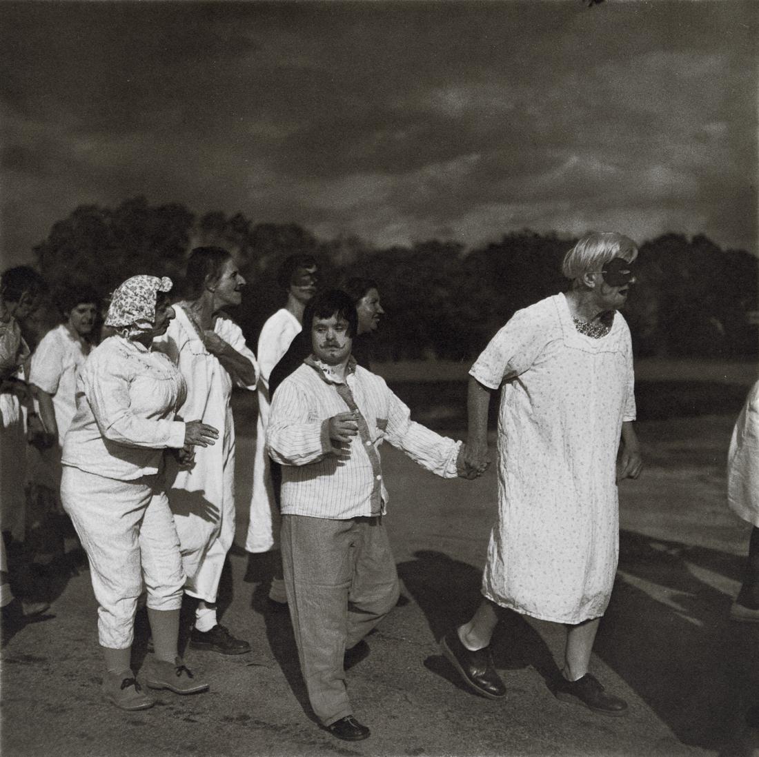 DIANE ARBUS - Untitled (7), 1970-71: Artist: Diane Arbus Title: Untitled (7), 1970-71 Medium: Photo Litho, 1972, USA Dimensions: 8.3x8.3" Description: Heat Wax Mounted on 11x14" Conservation Board Artist Bio: Diane Arbus was an American