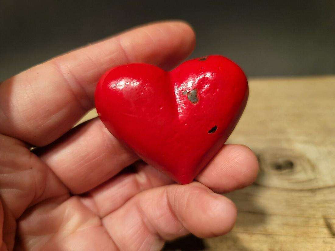 Cast Iron Heart: 1 7/8" Wide 1 3/4" tall A wonderful reproduction cast iron heart. Many times the symbol of a heart in an open palm is symbolic of an open welcome or charity. It has also been the symbol of the The Ind