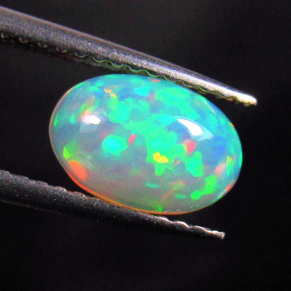 Natural Multicolor Opal - 0.89 Ct: Title: Natural Multicolor Opal - 0.89 Ct Origin: Ethiopia Weight: 0.89 Size/Dimensions: 8.9 x 6.1 x 3.5 mm Description: Pieces : 1 No's / Shape : Oval Cab / Clarity : Translucent / Treatment : None Re