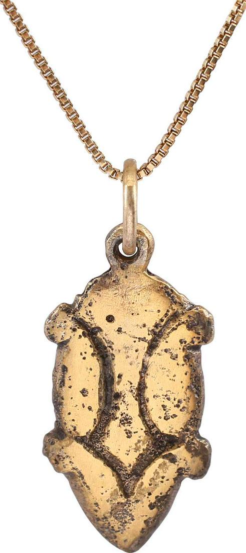 VIKING HEART PENDANT NECKLACE C.850-1050 AD: Gilt bronze. 1.08" height (27.5mm"). Evolutionary form in four elements with the sides and bottom forming a cusped top heard with quartered nubs. The top extends down as a point, a common form for Vik