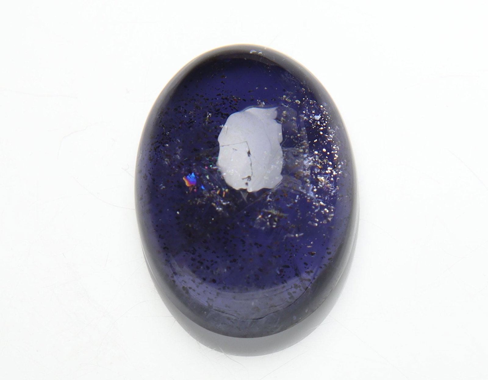 8.57 cts Natural Iolite: No Reserve! Title: 8.57 cts Natural Iolite Additional Information: Gemstone : Natural Iolite Shape and cut : Oval Cabochon Weight : 8.57 carats Measurements : 17x12 mm , Color : Violite Transparency :