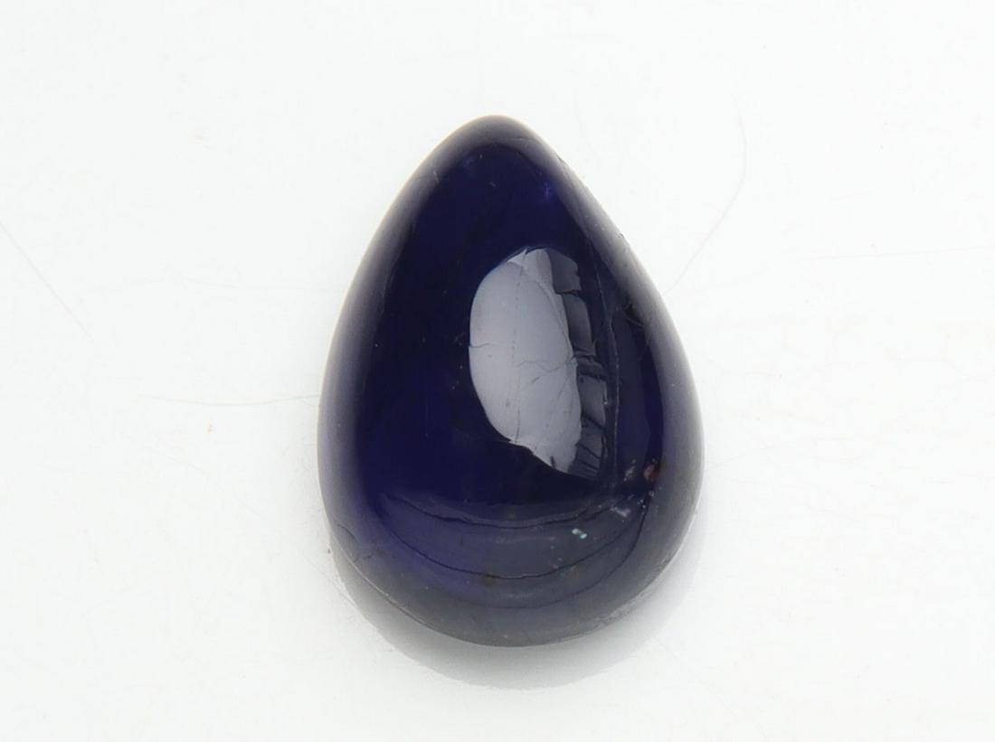 1.80 cts Natural Iolite: No Reserve! Title: 1.80 cts Natural Iolite Additional Information: Gemstone : Natural Iolite Shape and cut : Pear Cabochan Weight : 1.80 carats Measurements : 9.50x6.66x4.15 mm , Color : Violite Trans