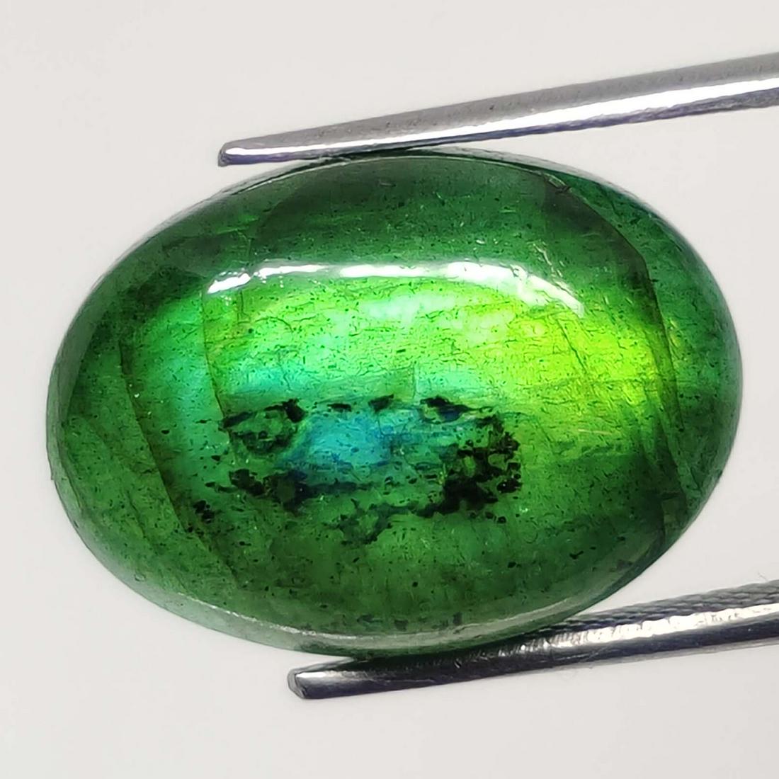 13.00 Ct "Stunning" Green Fire Labradorite: No Reserve! Title: 13.00 Ct "Stunning" Green Fire Labradorite Additional Information: Gemstones: Natural Labradorite Carat Weights: 13 ct Size/Dimensions: 18 X 13 X 6.40 mm Treatment: Color Dyed Mater