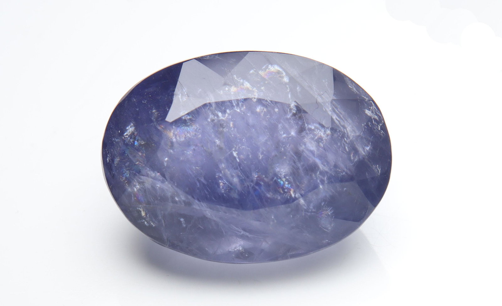 18.27 cts Natural Iolite: No Reserve! Title: 18.27 cts Natural Iolite Additional Information: Gemstone : Natural Iolite Shape and cut : Oval Cut Weight : 18.27 carats Measurements : 19.75x14.47x11.06 mm , Color : Violite Trans
