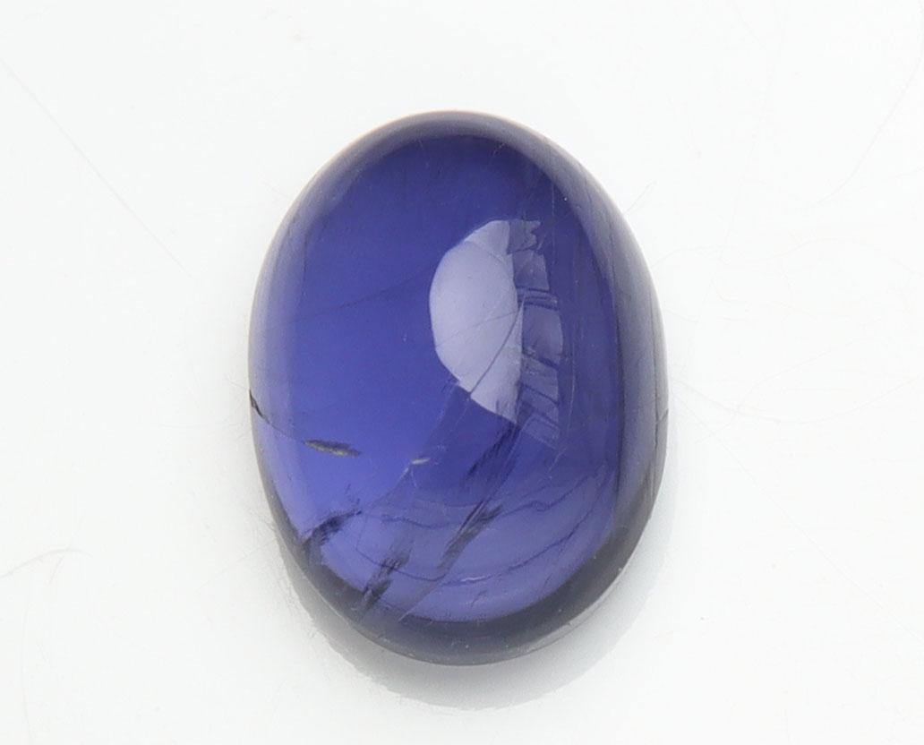 1.54 cts Natural Iolite: No Reserve! Title: 1.54 cts Natural Iolite Additional Information: Gemstone : Natural Iolite Shape and cut : Oval Cabochan Weight : 1.54 carats Measurements : 8.50x6.31x3.95 mm , Color : Violite Trans