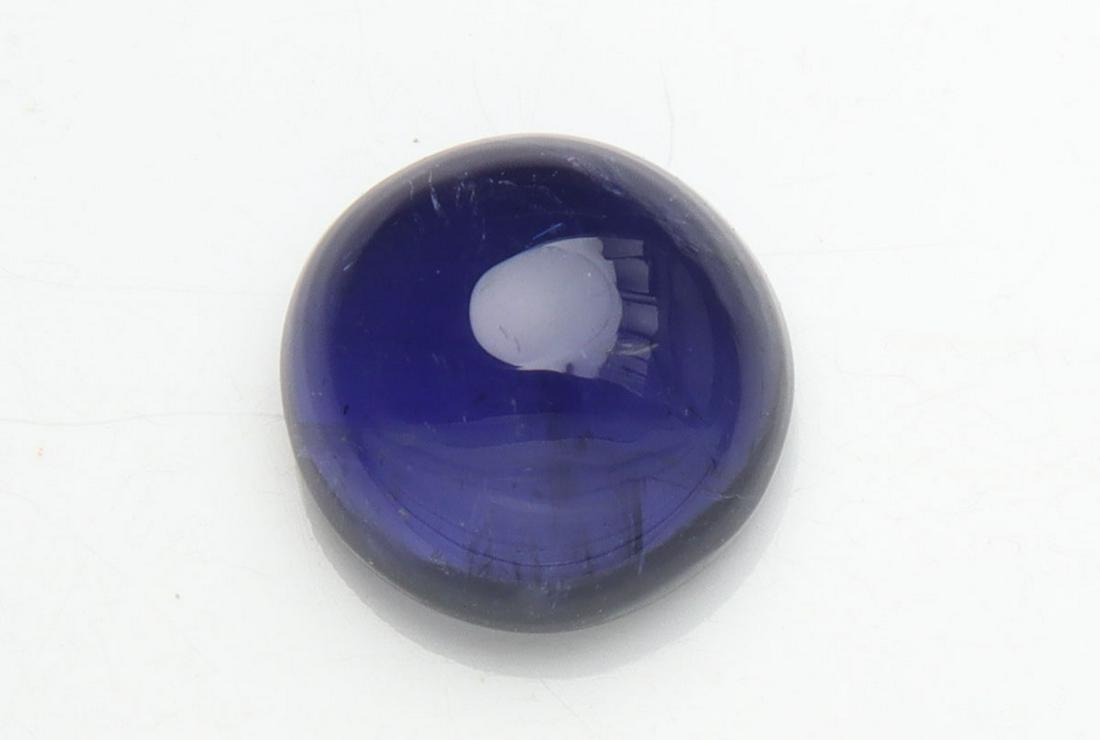 1.63 cts Natural Iolite: No Reserve! Title: 1.63 cts Natural Iolite Additional Information: Gemstone : Natural Iolite Shape and cut : Round Cabochan Weight : 1.63 carats Measurements : 7.50-7.48x4.11 mm , Color : Violite Tran