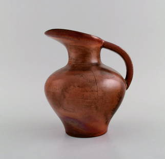 Richard Uhlemeyer (1900-1954), Germany. Jug in glazed ceramics. Beautiful glaze in metallic red: Richard Uhlemeyer (1900-1954), Germany. Jug in glazed ceramics. Beautiful glaze in metallic red shades. 1940s. Measures: 17 x 15.5 cm. In excellent condition. Stamped. Reserve: $210.00 Shipping: Domes