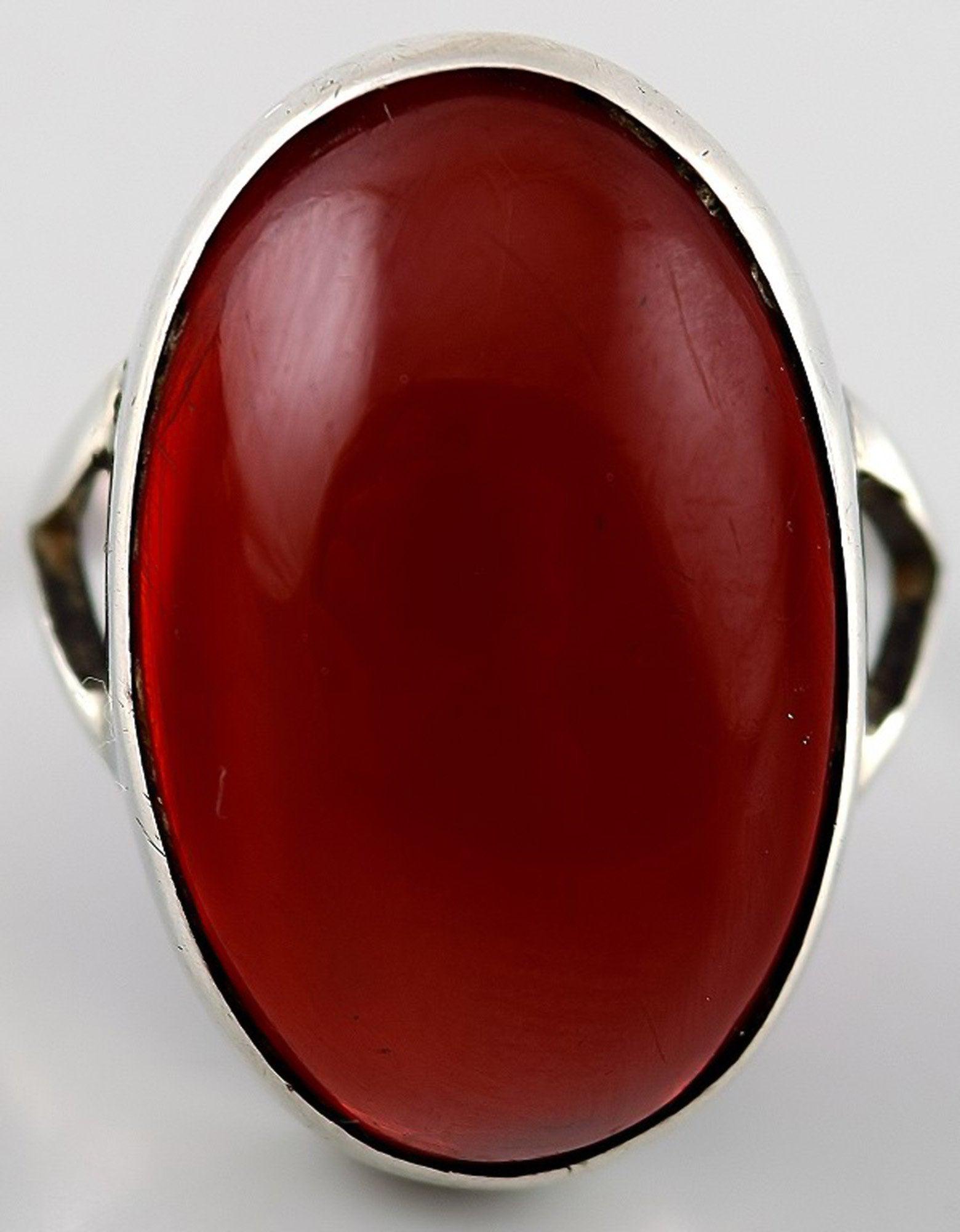 Silver ring with amber coloured stone. (1 of 2)
