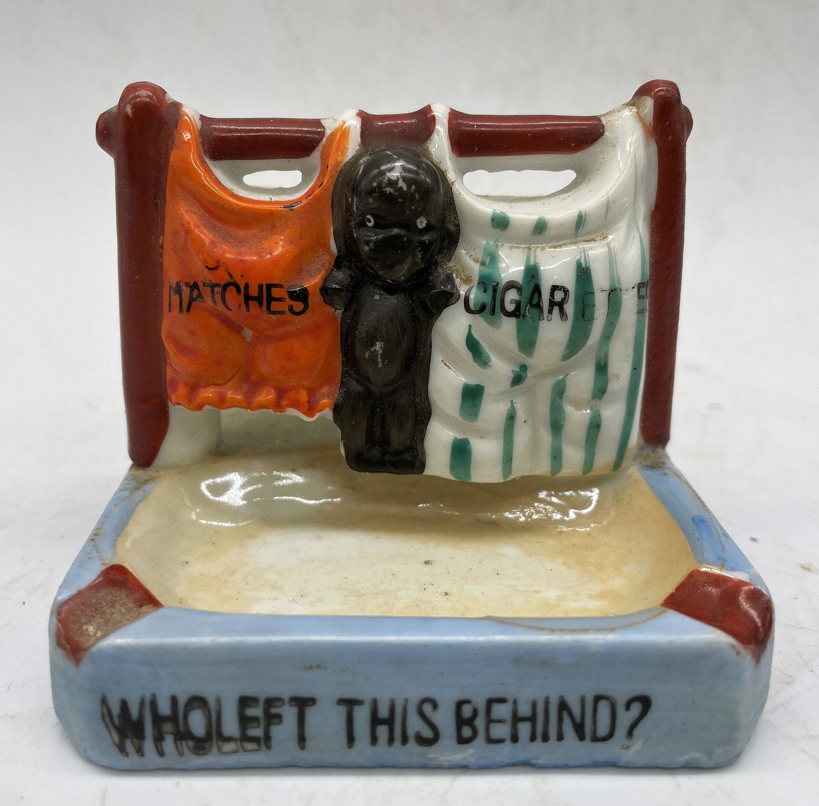 VINTAGE JAPAN BLACK AMERICANA "WHO LEFT THEM BEHIND" MATCHES CIGARETTES STRIKER: Title: VINTAGE JAPAN BLACK AMERICANA "WHO LEFT THEM BEHIND" MATCHES CIGARETTES STRIKER Date/Period: approx 1930's Dimension: approx 3 x 2.5 Material: porcelain ceramic Additional Information: VINTAGE 