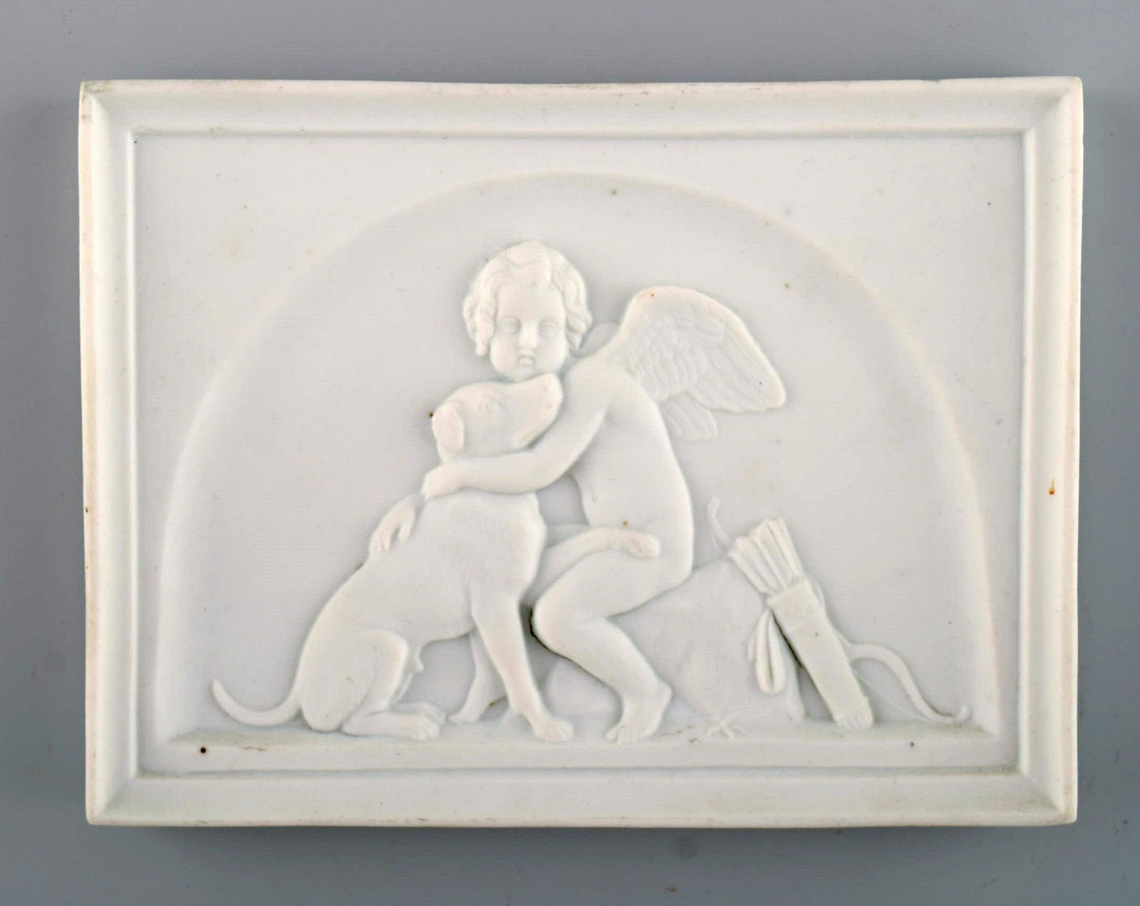Bing and Grøndahl after Thorvaldsen. Antique biscuit wall plaque. Cupid and a dog. Late 19th (1 of 4)
