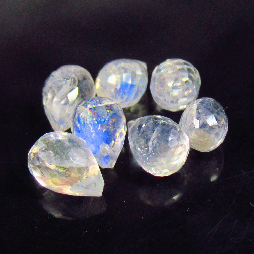 9.05 Ctw Natural 7 Blue Moonstone Pear Drop Beads: No Reserve! Title: 9.05 Ctw Natural 7 Blue Moonstone Pear Drop Beads Stone Clarity: Translucent Gemstones: Natural Moonstone Beads Carat Weights: 9.05 Size/Dimensions: 7.0x5.3 - 8.1x5.3 mm / 7 Pc's Ad